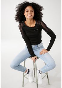 Kangaroos Damen Langarmshirt, schwarz, casual, Gr. 44, unifarben, kontrastfarbene Details, bedruckt, Rippware, Obermaterial: 100% Baumwolle. Spitze: